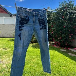 Pilcro & the Letterpress jeans with navy blue floral embroidery and raw hems